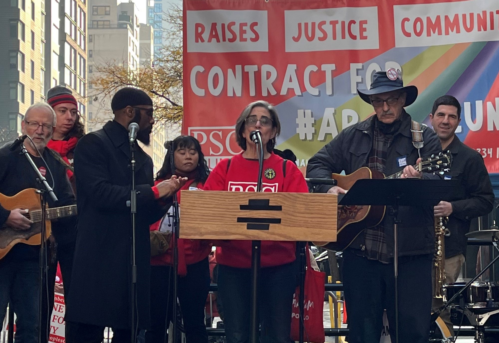 Jamel Cory Hudson, Professor at Baruch College and Andrea Vasquez, PSC First Vice President performing at the Sing Out Shout Out Rally for #APeoplesCUNY by Lucy Scalici