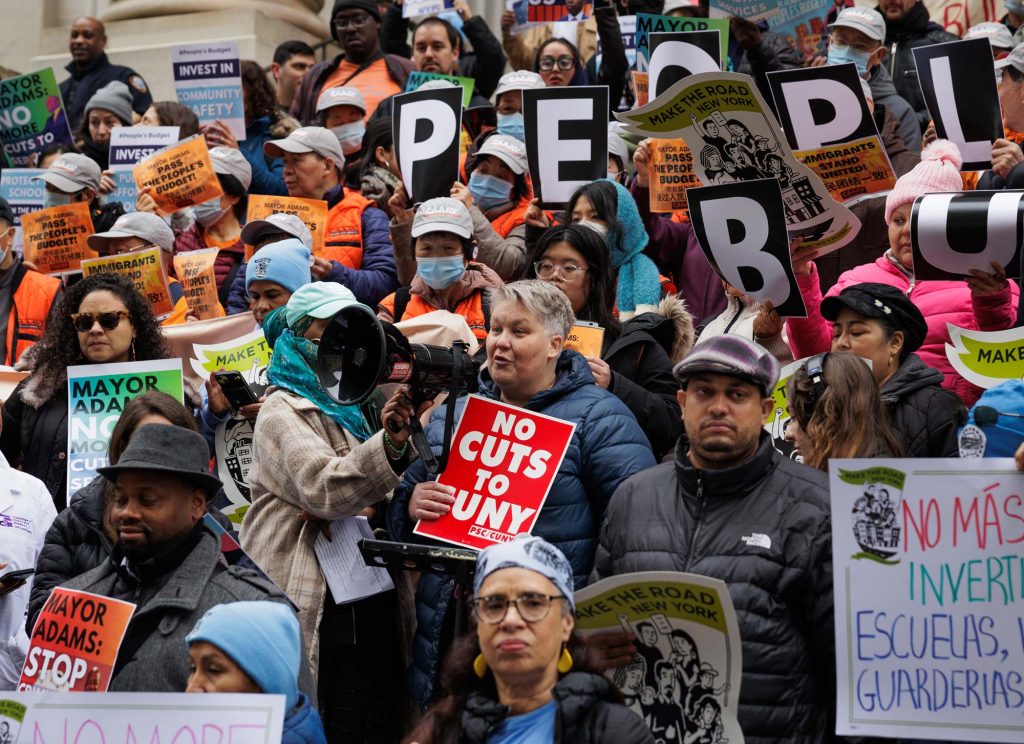 Jen Gaboury (center) addresses an anti-austerity rally in Manhattan.