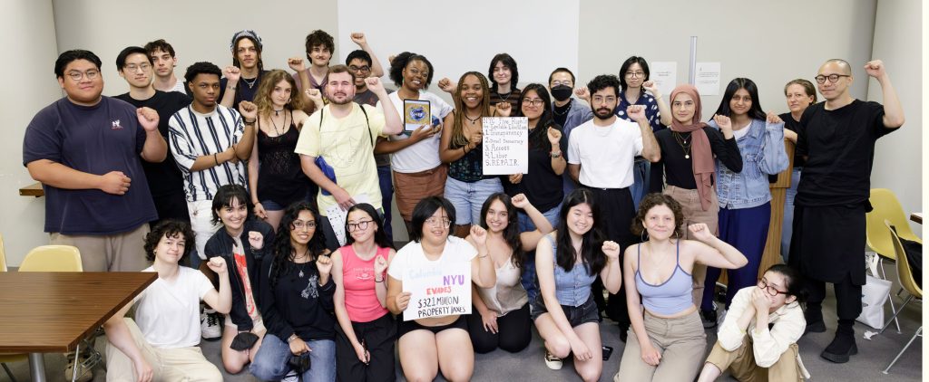 Students stand together with signs in uspport of the REPAIR act