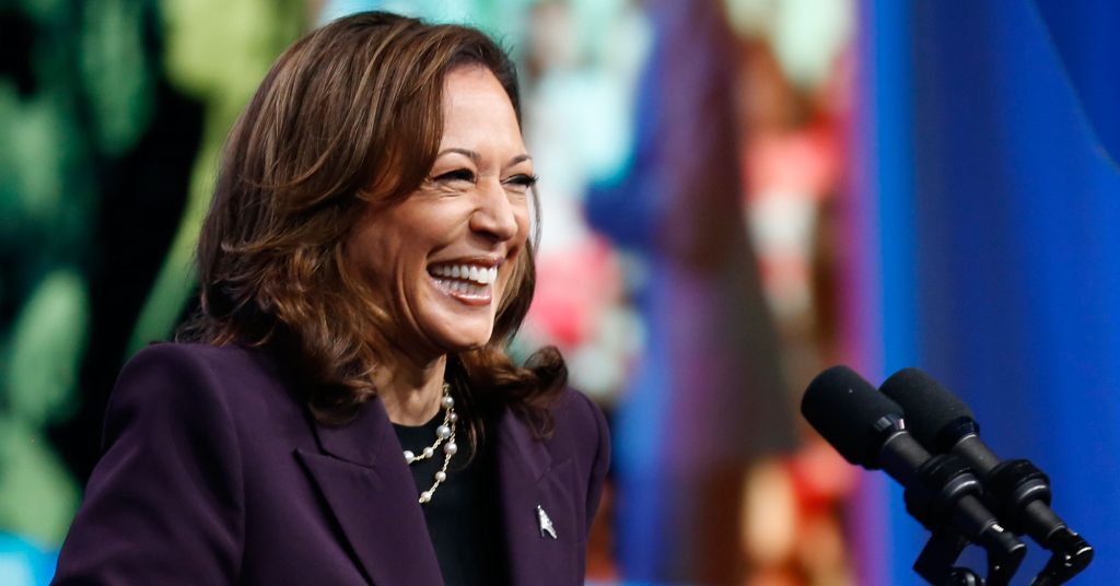 Kamala Harris smiling in front of AFT backdrop