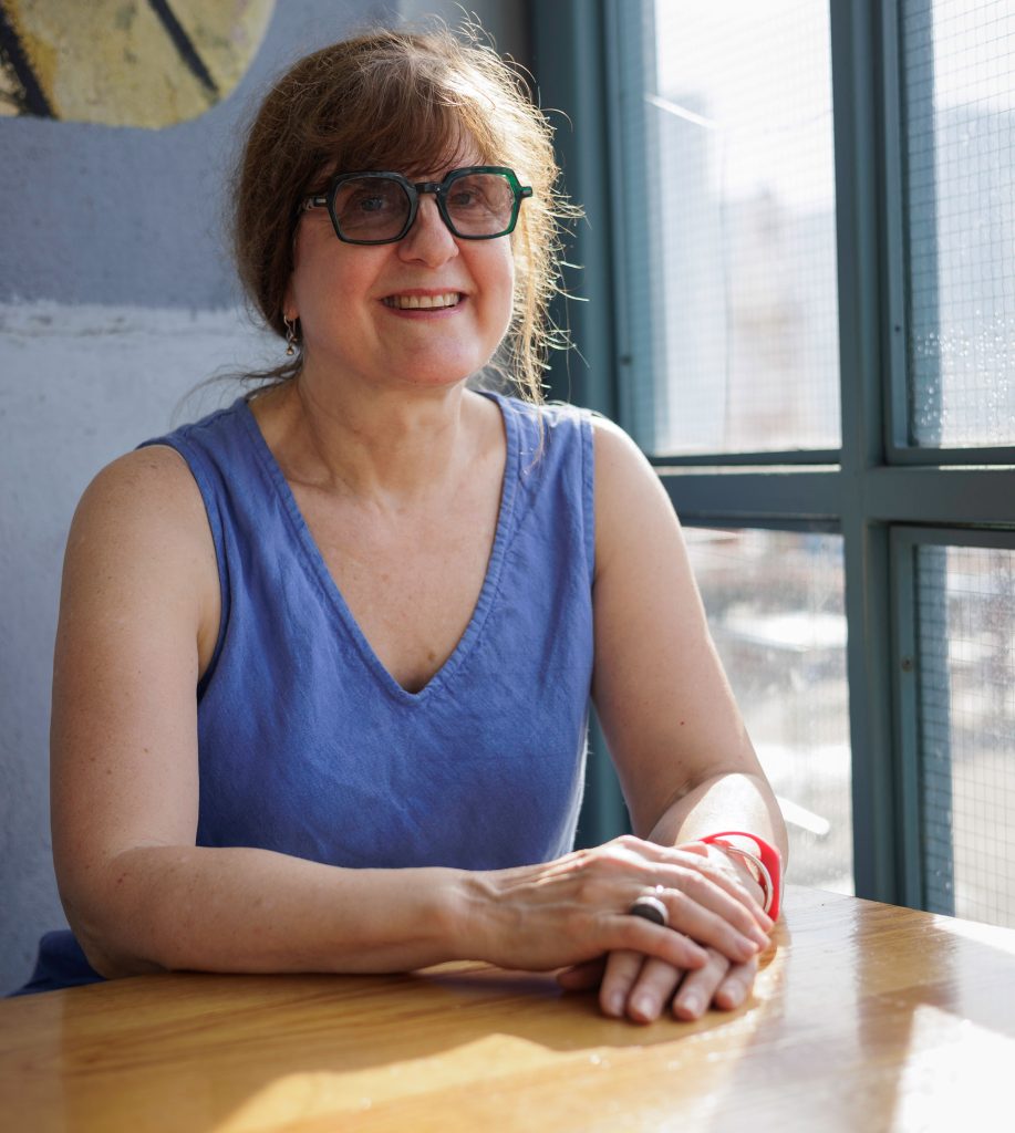 Smiling member sitting at desk