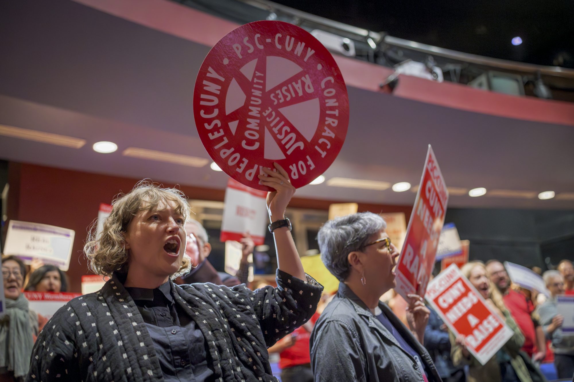 PSC members disrupt the CUNY Trustees hearing to demand management provide a fair economic offer (Photo by Erik McGregor)