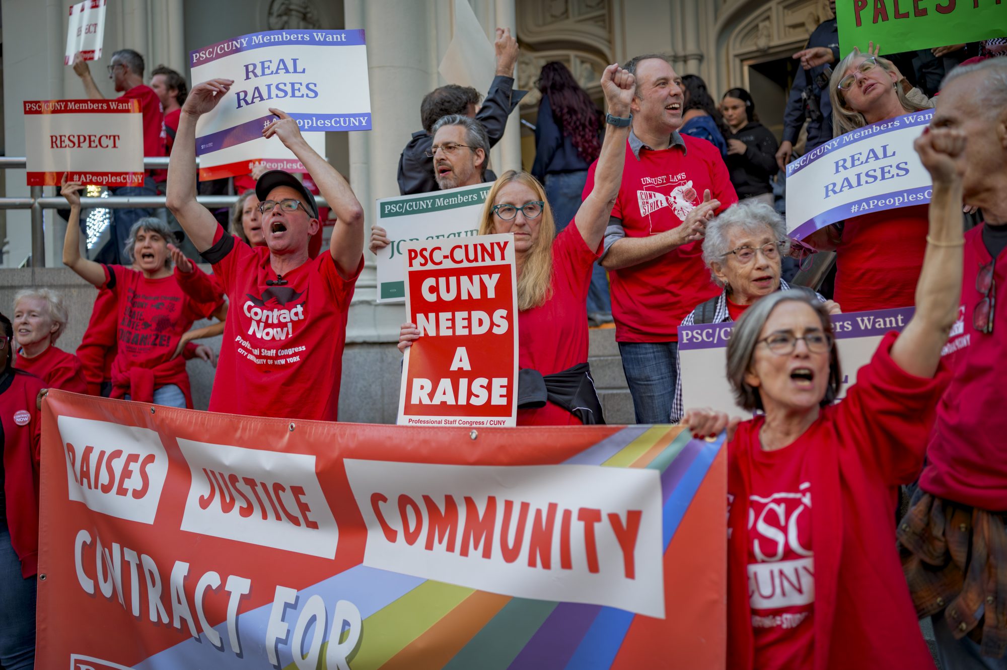 More than 30 faculty and staff block entrance to the CUNY Trustees hearing, demanding a fair contract offer (Photo by Erik McGregor)