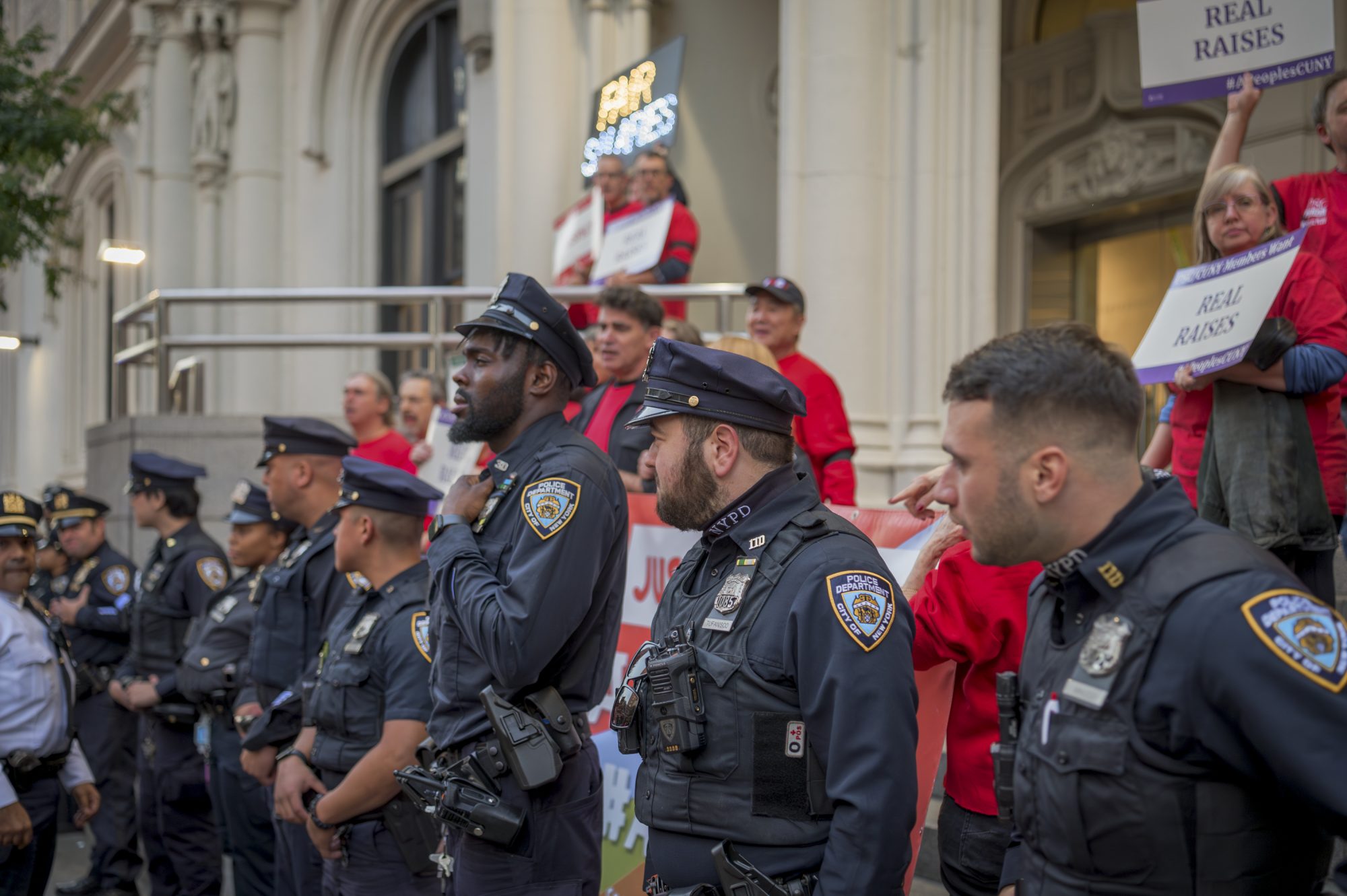 Police move to arrest more than 30 faculty and staff blocking entrance to the CUNY Trustees hearing (Photo by Erik McGregor)