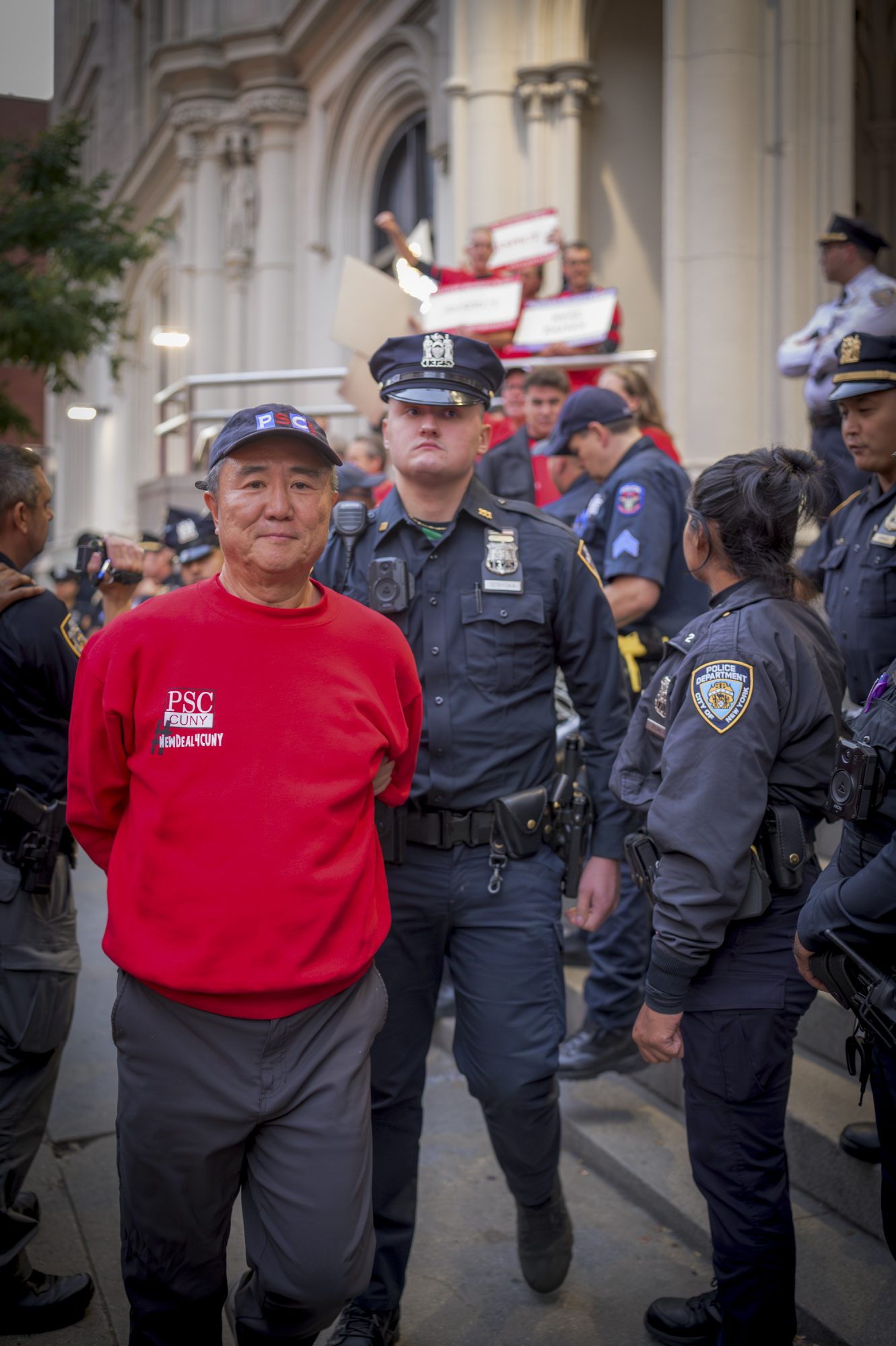 PSC Members are arrested while demanding a fair economic offer from CUNY Trustees (Photo by Erik McGregor)